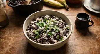 Traditional Cuban Moros y Cristianos served in a rustic ceramic bowl