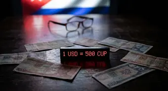 Representation of the Cuban peso crisis with bills and screen showing exchange rate