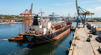 A large Russian oil tanker docking at a Cuban industrial port under the tropical sun