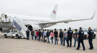 Cuban migrants boarding ICE deportation flight
