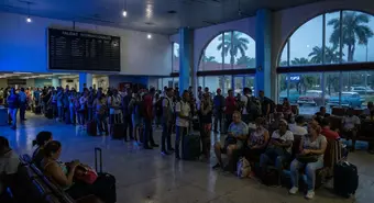 International travelers wait at José Martí Airport in Havana during a partial blackout.