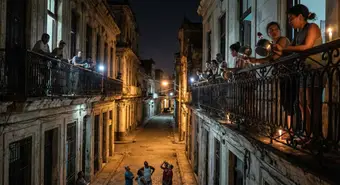 Neighbors in Miramar, Havana, protesting with pots and pans during a night blackout.