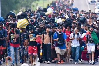 Group of migrants walking along highway in protest from Tapachula, Mexico