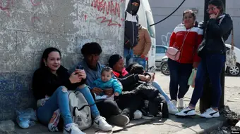 Cuban migrants at a South American airport with luggage