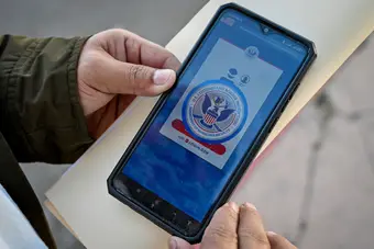 CBP One mobile application on a phone, used by migrants to schedule legal border appointments
