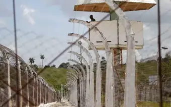 Façade of a prison in Cuba with guards