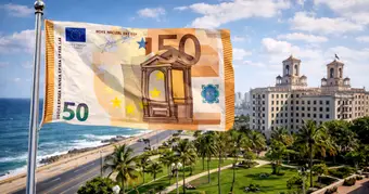 Bundle of Cuban pesos, Euros, and US Dollar bills on a table