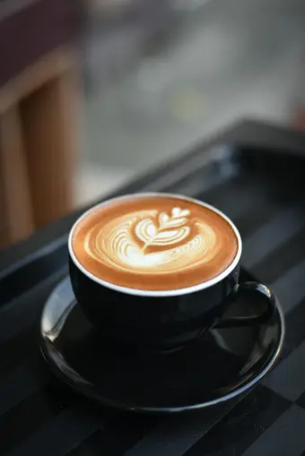 Cup of espresso coffee on a wooden table. Photo: Pexels