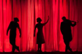 Theatrical stage with dramatic lighting. Photo: Unsplash